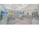 Spacious living area with a modern kitchen, tile floors, and comfortable seating arrangement at 21287 Sandal Foot Dr, Venice, FL 34293