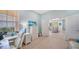 Bright home office with a modern desk, chair, and stylish decor leading to living space at 21287 Sandal Foot Dr, Venice, FL 34293