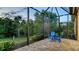 Charming patio area offers brick pavers, lovely views, and a screened enclosure at 21287 Sandal Foot Dr, Venice, FL 34293
