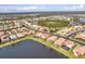 An aerial view of the houses and lakes in this sprawling Primary planned community at 2212 Weaver Bird Ln, Venice, FL 34292