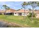 Backyard of home offers a beautiful lawn and view of the water at 2212 Weaver Bird Ln, Venice, FL 34292