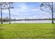 Enjoy serene waterfront views from this beautifully landscaped backyard at 2212 Weaver Bird Ln, Venice, FL 34292