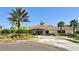 Community center featuring lush landscaping and a circular drive at 2212 Weaver Bird Ln, Venice, FL 34292