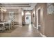 Inviting foyer featuring tile flooring, tray ceilings, and a view of the front door at 2212 Weaver Bird Ln, Venice, FL 34292