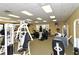 Community gym area with several cardio machines and weight-lifting stations available to residents at 2212 Weaver Bird Ln, Venice, FL 34292