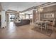 Bright open-plan living room and dining area with neutral walls and stylish tile flooring at 2212 Weaver Bird Ln, Venice, FL 34292