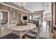 This open-concept living space includes a dining area, living room, and sliding doors to the lanai at 2212 Weaver Bird Ln, Venice, FL 34292