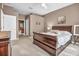 Comfortable main bedroom, showcasing neutral walls and carpet, with an en-suite bathroom at 2212 Weaver Bird Ln, Venice, FL 34292