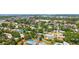 Stunning aerial view of a charming single-Gathering home featuring a private pool and lush landscaping in a desirable neighborhood at 2220 Palm Ter, Sarasota, FL 34231