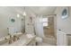 Well-lit bathroom featuring a vanity sink, toilet, and a shower-tub combination at 2220 Palm Ter, Sarasota, FL 34231