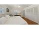 Inviting bedroom with hardwood floors, ample natural light, a ceiling fan, and closet storage at 2220 Palm Ter, Sarasota, FL 34231