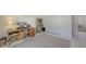 Bright bedroom featuring an office desk, neutral toned rug, and built in closet at 2220 Palm Ter, Sarasota, FL 34231