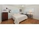 Bedroom with wood floors, plantation shutters, and a queen-sized bed at 2220 Palm Ter, Sarasota, FL 34231