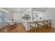 Modern kitchen features white cabinets, stainless steel appliances, and a breakfast bar with seating at 2220 Palm Ter, Sarasota, FL 34231