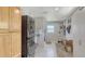 Spacious laundry room with modern washer and dryer, ample storage cabinets, and tile flooring at 2220 Palm Ter, Sarasota, FL 34231
