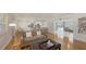 Bright living room showcases an open layout with hardwood floors and seamless flow to the kitchen at 2220 Palm Ter, Sarasota, FL 34231