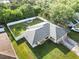 Aerial view of the home, highlighting the roof, landscaping, and fully fenced backyard at 2272 Palomar St, North Port, FL 34287