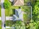 Aerial view showcases the home's layout, landscaping, and fully fenced yard at 2272 Palomar St, North Port, FL 34287
