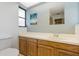 Bathroom featuring a vanity with wood cabinets, sink, and a mirror at 2272 Palomar St, North Port, FL 34287
