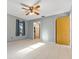 Spacious bedroom with tile flooring, ceiling fan, closet and en-suite bathroom access at 2272 Palomar St, North Port, FL 34287