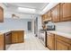 Kitchen area with wooden cabinets and stainless steel oven at 2272 Palomar St, North Port, FL 34287