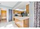 Kitchen featuring wood cabinets, white countertops, and a breakfast bar at 2272 Palomar St, North Port, FL 34287