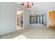 Open floor plan connecting the living room to the kitchen, featuring carpeted floors at 2272 Palomar St, North Port, FL 34287