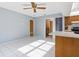 Living space featuring tile floors and ample natural light with easy access to the kitchen at 2272 Palomar St, North Port, FL 34287