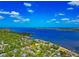 Desirable waterfront property surrounded by lush trees, offering picturesque bay views at 2305 Riverview Blvd, Bradenton, FL 34205