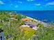 Stunning waterfront home featuring a spacious yard, screened lanai, and private dock access to the serene blue waters at 2305 Riverview Blvd, Bradenton, FL 34205
