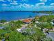 Charming waterfront home with lush green lawns and mature landscaping at 2305 Riverview Blvd, Bradenton, FL 34205