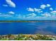Breathtaking waterfront views with a picturesque scene of homes and lush greenery at 2305 Riverview Blvd, Bradenton, FL 34205