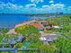 Waterfront home situated on a beautifully landscaped lot with mature trees and views of the city skyline at 2305 Riverview Blvd, Bradenton, FL 34205