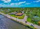 Beautiful waterfront home on a corner lot surrounded by lush landscaping with views of the water at 2305 Riverview Blvd, Bradenton, FL 34205