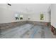 Bright bedroom features natural light from windows and ceiling fan at 2305 Riverview Blvd, Bradenton, FL 34205