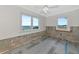 Bedroom with bay view features natural light from windows and ceiling fan at 2305 Riverview Blvd, Bradenton, FL 34205