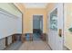 Bright entryway with decorative glass door, neutral paint, and paneled walls at 2305 Riverview Blvd, Bradenton, FL 34205