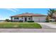 Beautiful single-story home with a well-maintained lawn and a two-car garage at 2305 Riverview Blvd, Bradenton, FL 34205