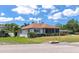Charming single-story home featuring lush landscaping, a screened lanai, and well-maintained curb appeal at 2305 Riverview Blvd, Bradenton, FL 34205