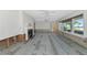 Living room with fireplace and large windows offering beautiful waterfront views at 2305 Riverview Blvd, Bradenton, FL 34205