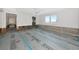 Spacious living room ready for customization with a picturesque waterfront view from the window at 2305 Riverview Blvd, Bradenton, FL 34205