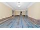 Unfinished living room featuring crown molding with exposed framework ready for renovation at 2305 Riverview Blvd, Bradenton, FL 34205