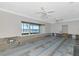 Bright living room featuring expansive windows with waterfront views at 2305 Riverview Blvd, Bradenton, FL 34205