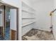 Unfinished pantry with multiple shelves and exposed framework ready for renovation at 2305 Riverview Blvd, Bradenton, FL 34205