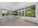 Screened-in porch with a tile floor and views of the backyard landscaping at 2305 Riverview Blvd, Bradenton, FL 34205