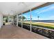 Large screened porch with brick floors, ceiling fans, and waterfront views at 2305 Riverview Blvd, Bradenton, FL 34205