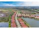 Aerial view of the community with lakes and nature preserves, showcasing the peaceful setting at 23261 Banbury Way # 501, Venice, FL 34293