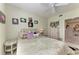 Bedroom featuring a queen bed, decorative pillows and floral pictures on the wall at 23261 Banbury Way # 501, Venice, FL 34293