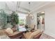 Bright dining area with glass table, views of the lush outdoors, and easy access to the kitchen at 23261 Banbury Way # 501, Venice, FL 34293