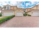 This townhouse has three garage spaces and brick driveway at 23261 Banbury Way # 501, Venice, FL 34293